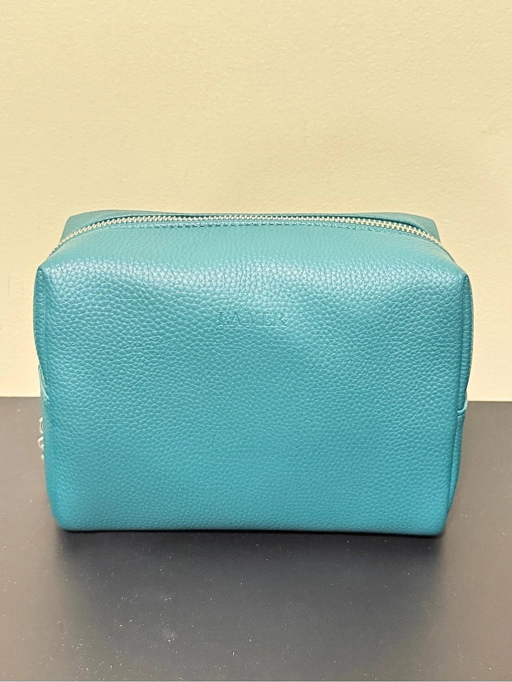 La Mer Teal green cosmetic bag